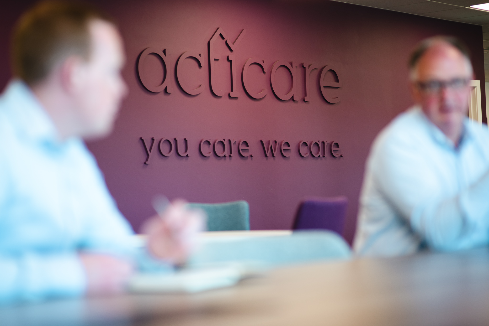 Acticare logo on a wall