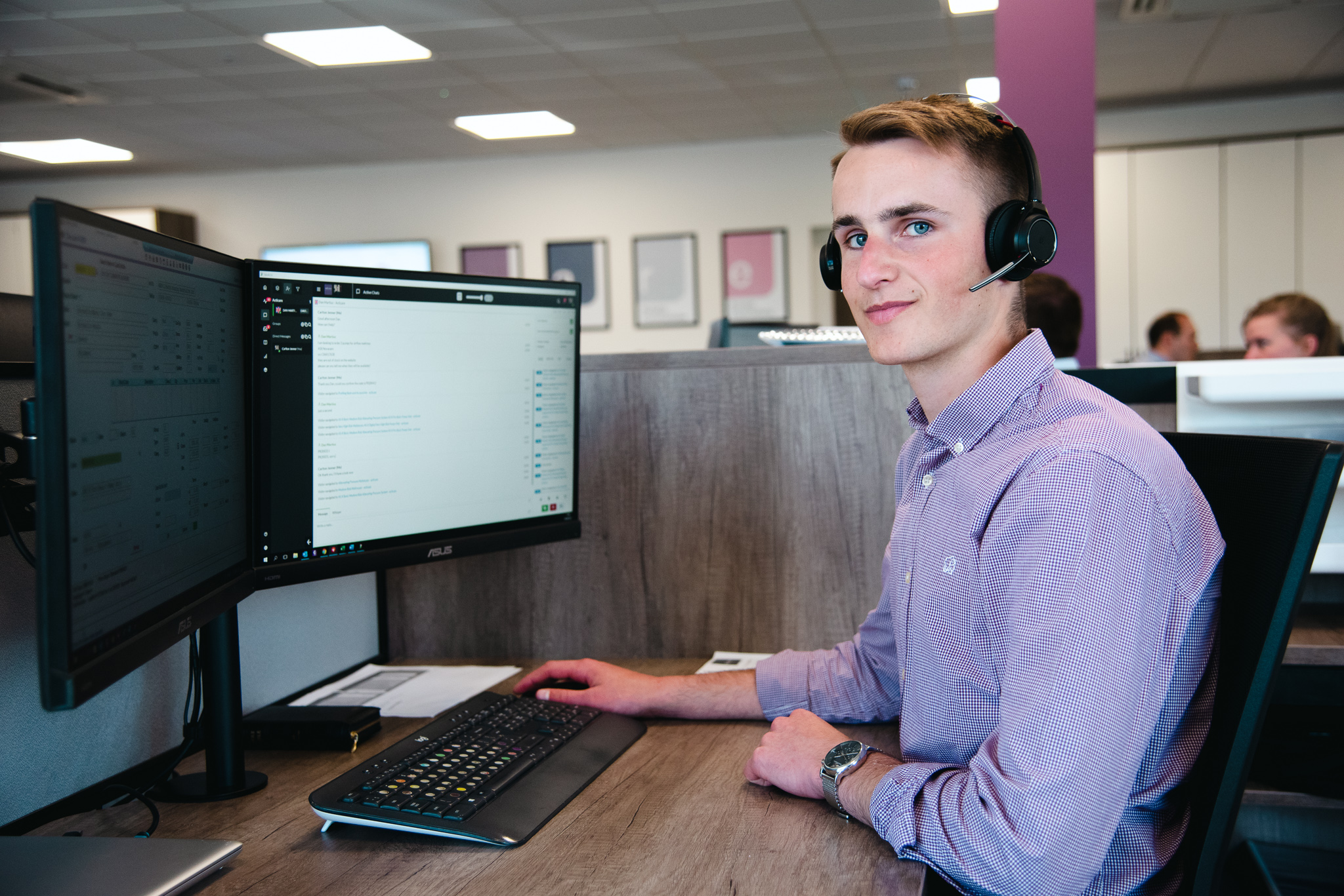 Acticare team member sat at their desk