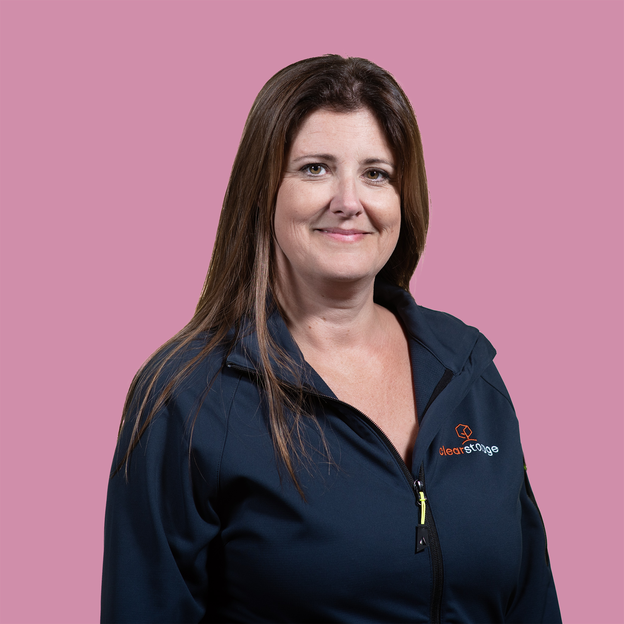 Headshot of a woman with pink background